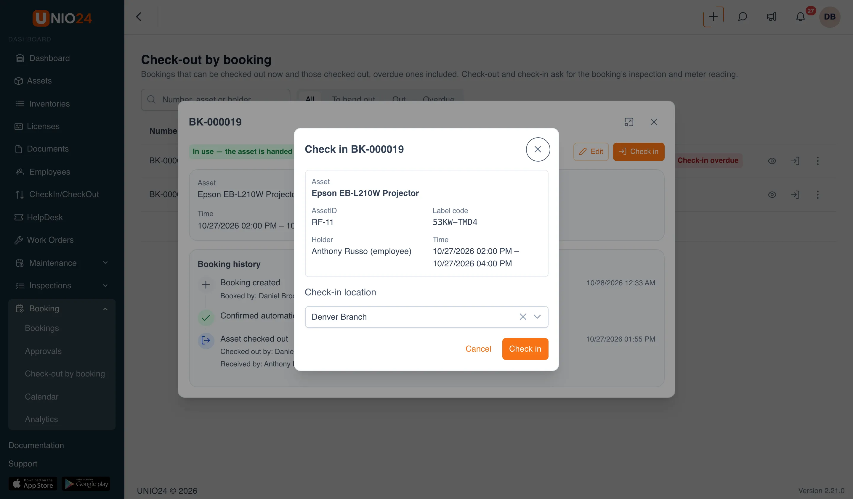 The “Check in BK-000019” window over the booking card: a summary with the asset, AssetID, label code, holder, and time, the Check-in location field, and Cancel and Check in buttons